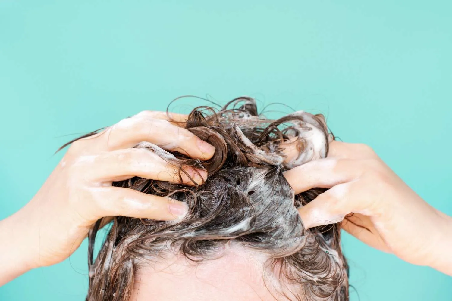 washing hair with hard water showing buildup and scalp impact