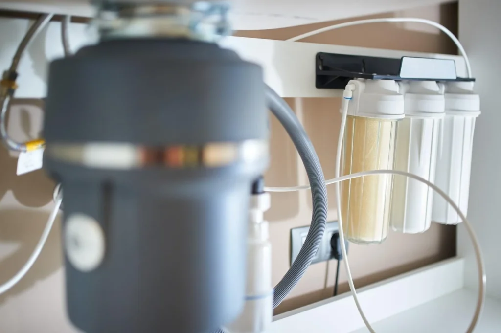 Household water filtration system installed under kitchen sink for clean drinking water